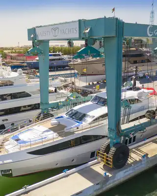 "Luxury yacht at marina with large boat lift - Scott Bader gelcoats and composites used in marine applications" [G]
