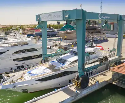 "Luxury yacht at marina with large boat lift - Scott Bader gelcoats and composites used in marine applications" [G]