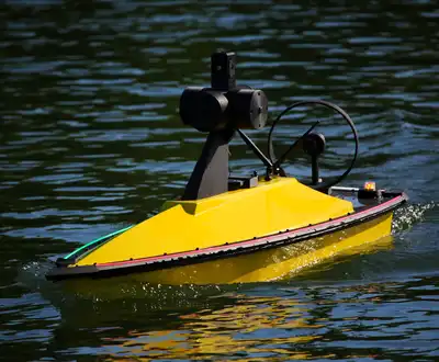 "Yellow unmanned marine vessel on water, featuring Scott Bader composites and gelcoats for watercraft durability" [G]
