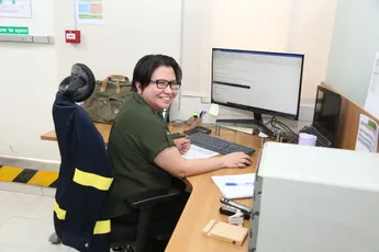 "Scott Bader team member at workstation managing composite materials data and production information" [G]