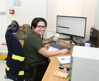 "Scott Bader team member at workstation managing composite materials data and production information" [G]