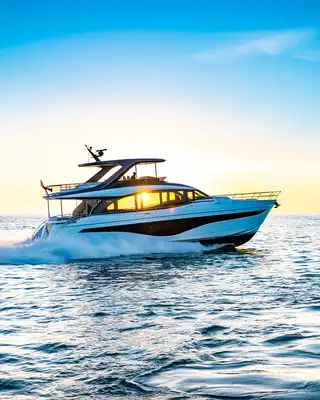 "Luxury yacht cruising on ocean at sunset - Scott Bader gelcoats and composites for superior marine applications" [G]