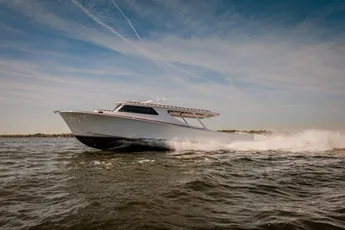 "Sleek white speedboat racing across water, showcasing Scott Bader gelcoats and composites used in marine applications" [G]