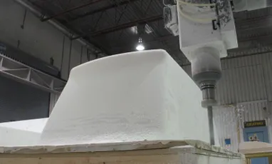 "Industrial CNC machine processing white composite material in Scott Bader manufacturing facility for gelcoats production" [G]