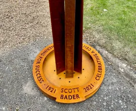 "Scott Bader commemorative sculpture base with metal pillars, celebrating 100 years of achievements in composites and adhesives" [G]