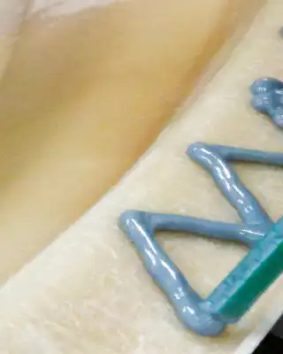 "Application of Scott Bader gelcoats on a smooth composite surface, showcasing the finishing process for marine materials" [G]