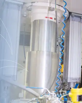 "Industrial technicians monitoring Scott Bader resin manufacturing equipment in a production facility for composite materials" [G]