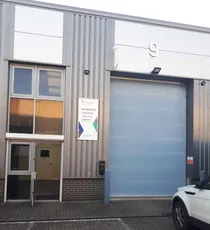 "Modern industrial unit with Scott Bader signage, showcasing their manufacturing facility for composites and adhesives" [G]