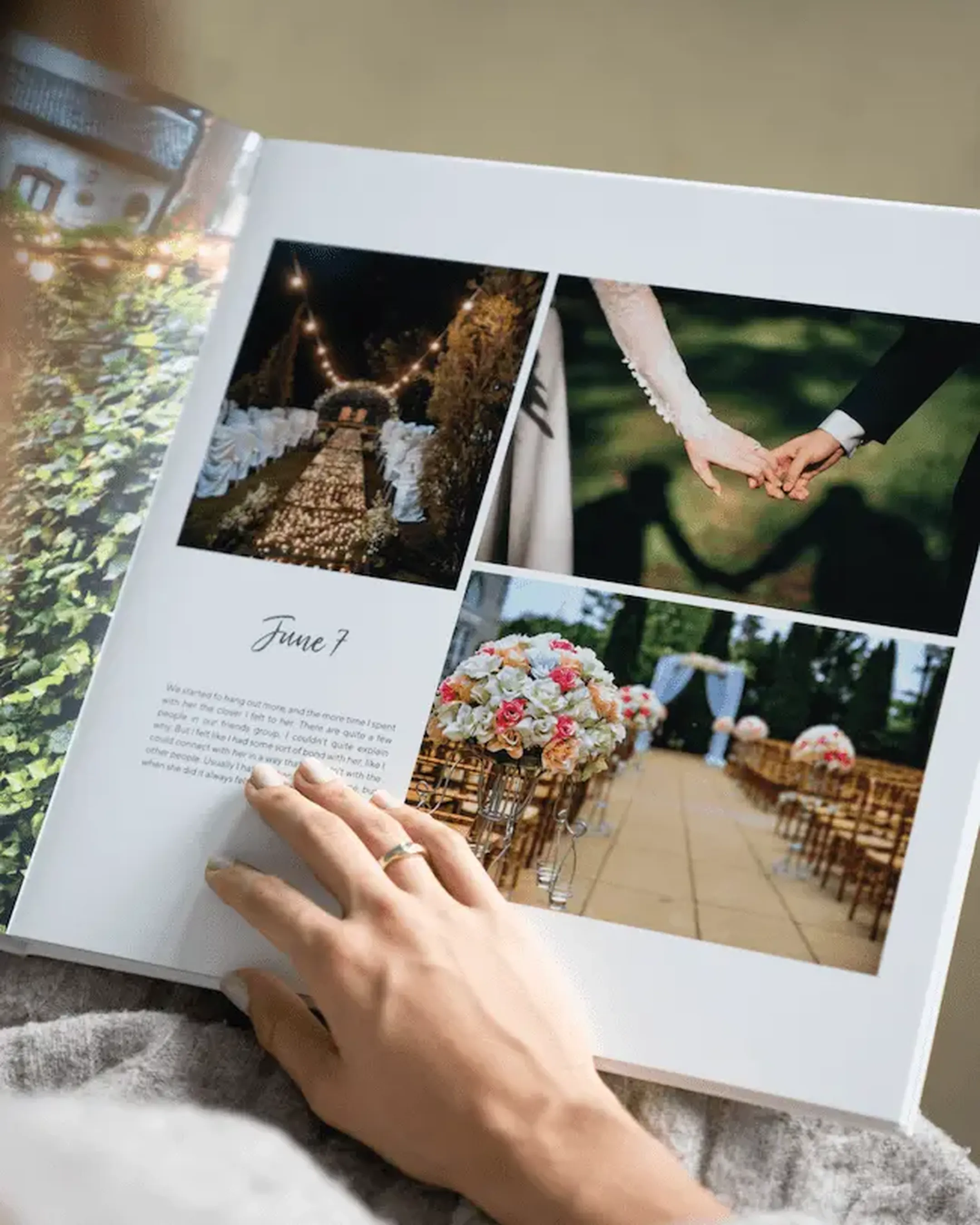 Person with a ring views a wedding photo album featuring images of a ceremony aisle, a couple holding hands, and a floral arrangement.