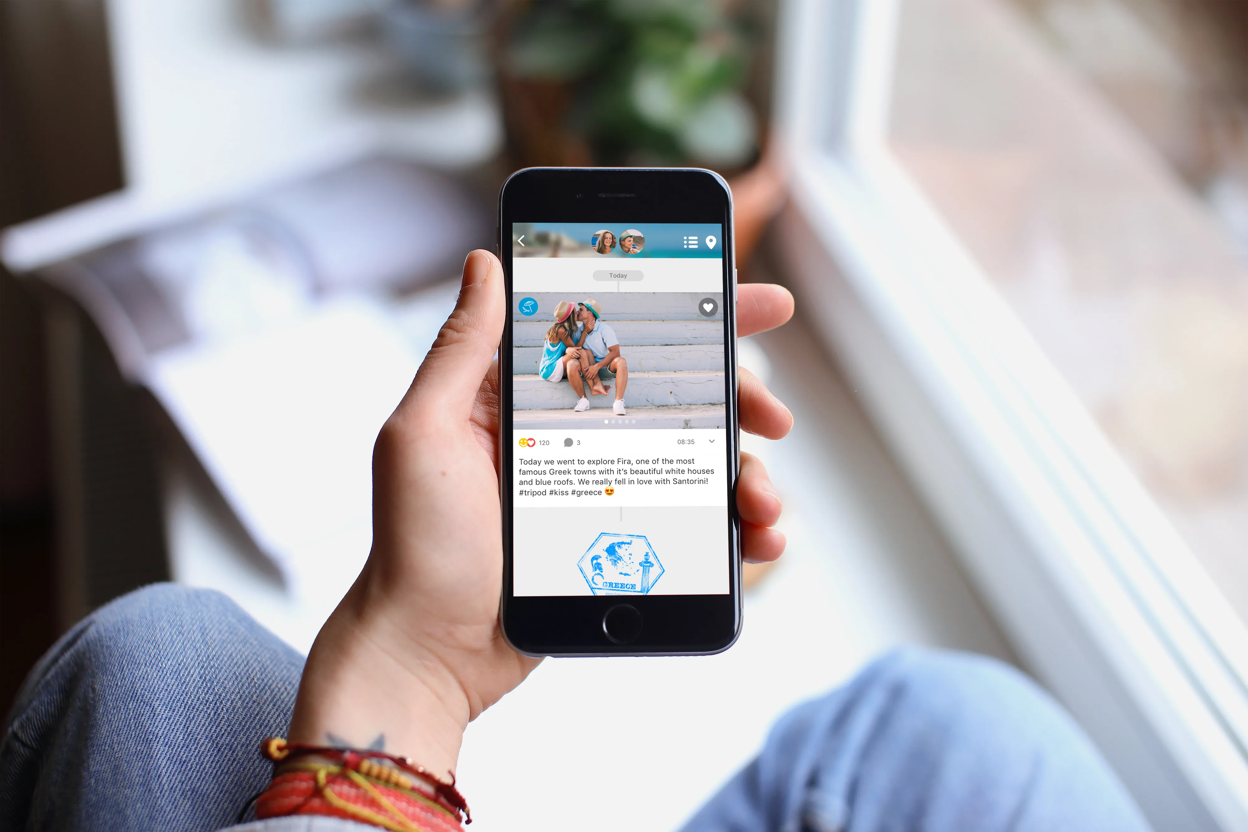 a person holding a phone in their hand with the Journi app
