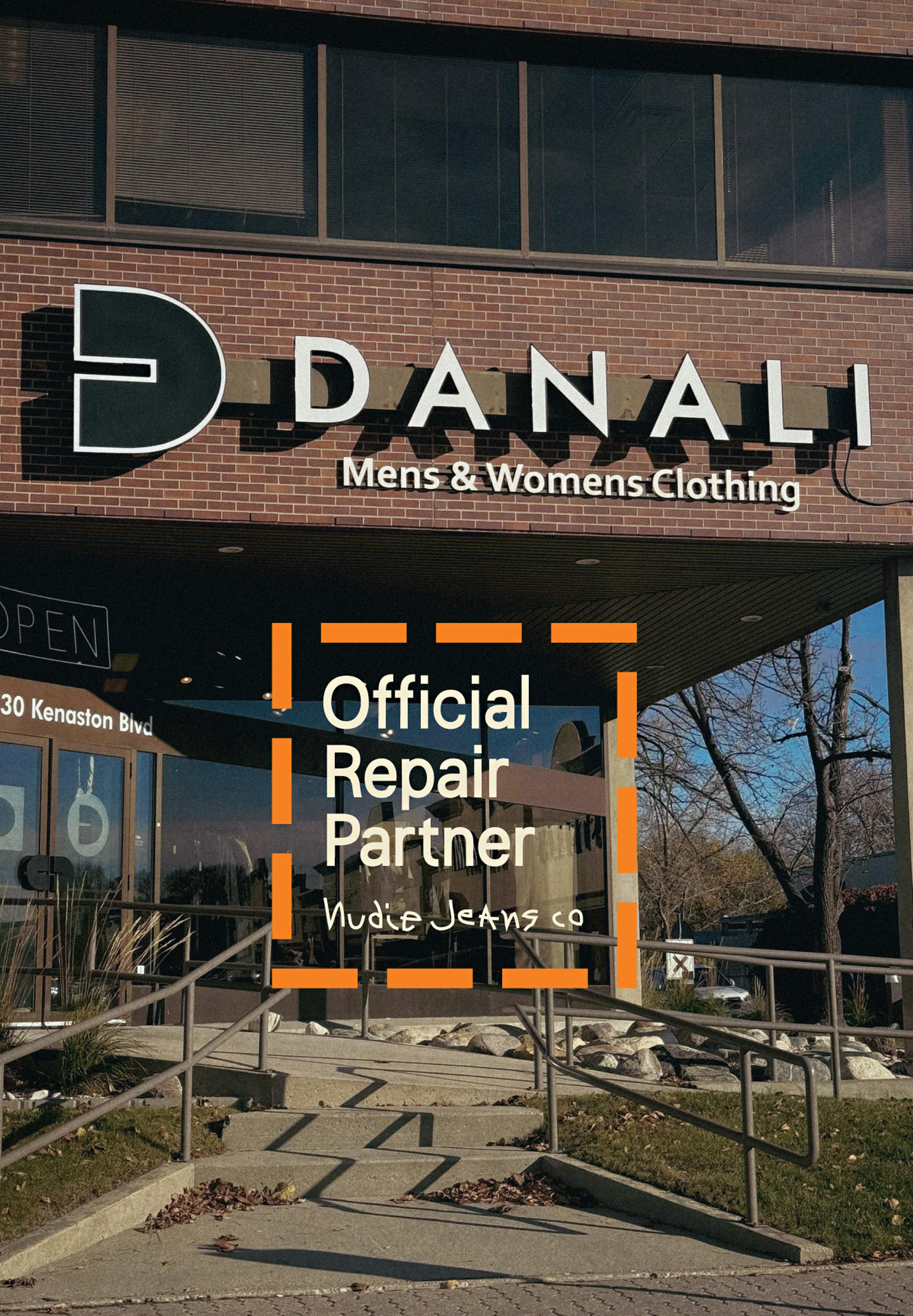 Storefront of "Danali Men’s & Women’s Clothing," displaying a sign for "Official Repair Partner" with Nudie Jeans branding.