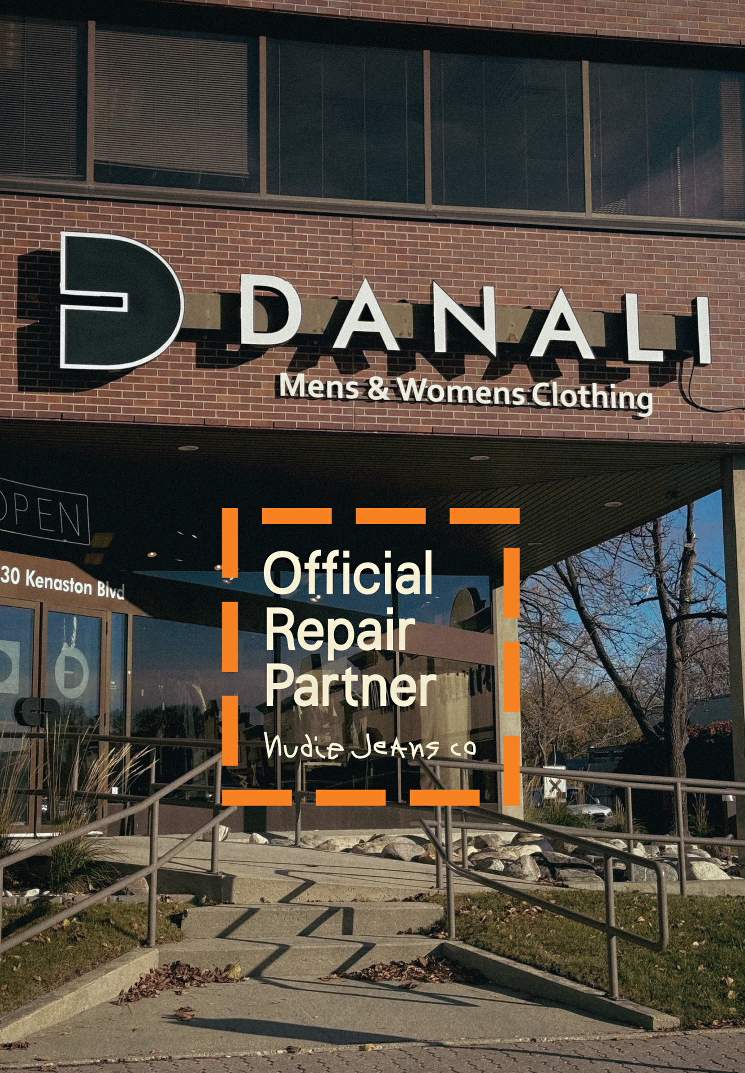 Storefront of "Danali Men’s & Women’s Clothing," displaying a sign for "Official Repair Partner" with Nudie Jeans branding.
