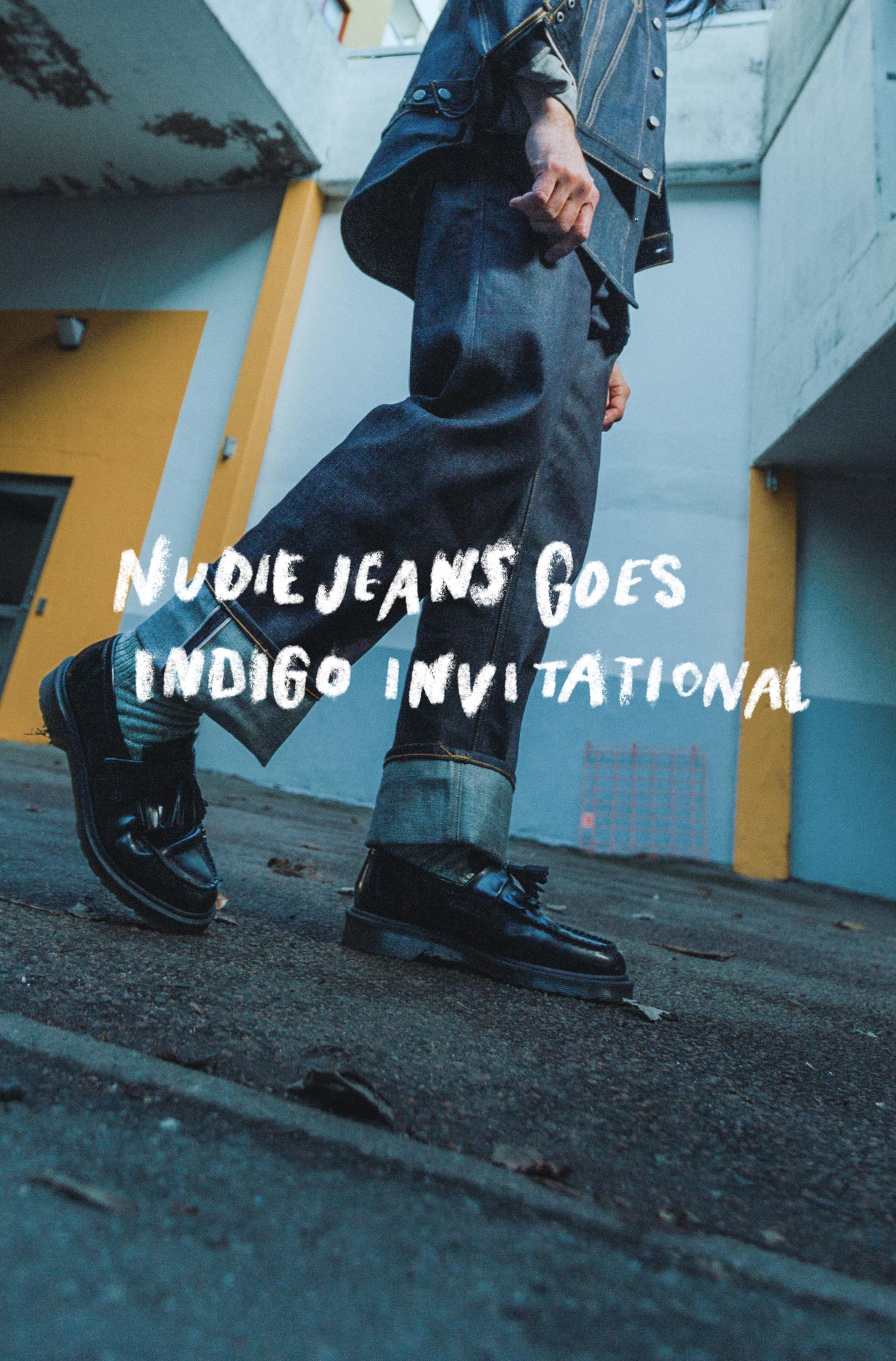 Person in denim walking, wearing black shoes, with "Nudie Jeans Goes Indigo Invitational" text overlay. Urban background with yellow accents.