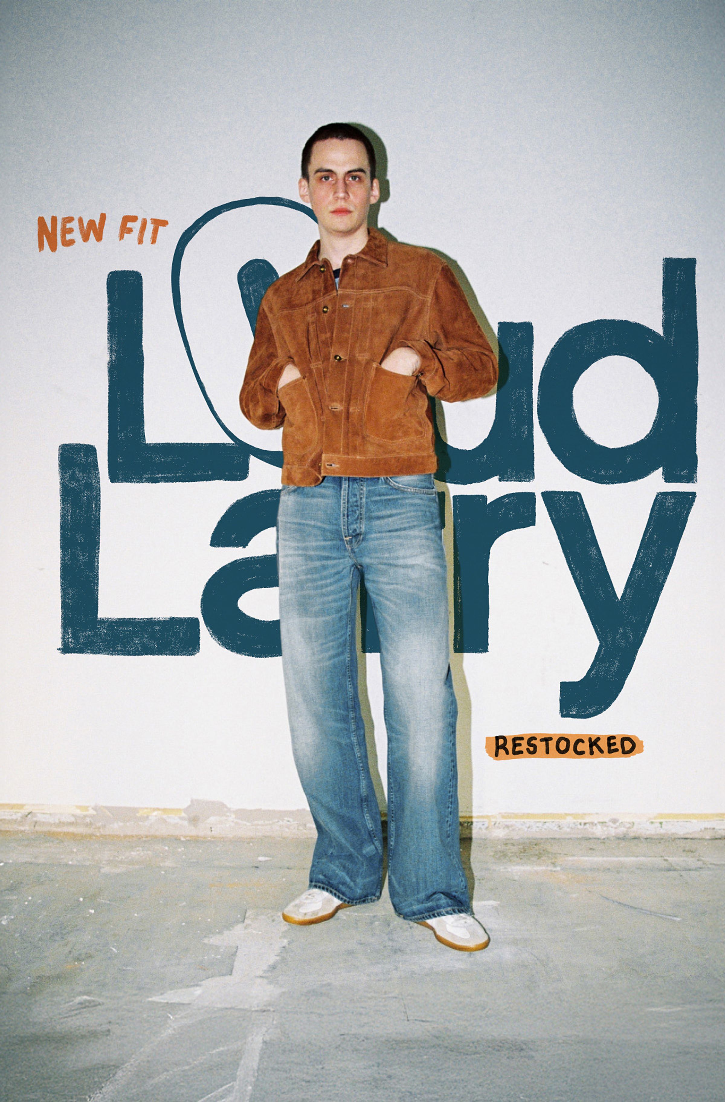 Person in a brown jacket and jeans stands against a wall with "Loud Larry," "New Fit," and "Restocked" written in bold letters.