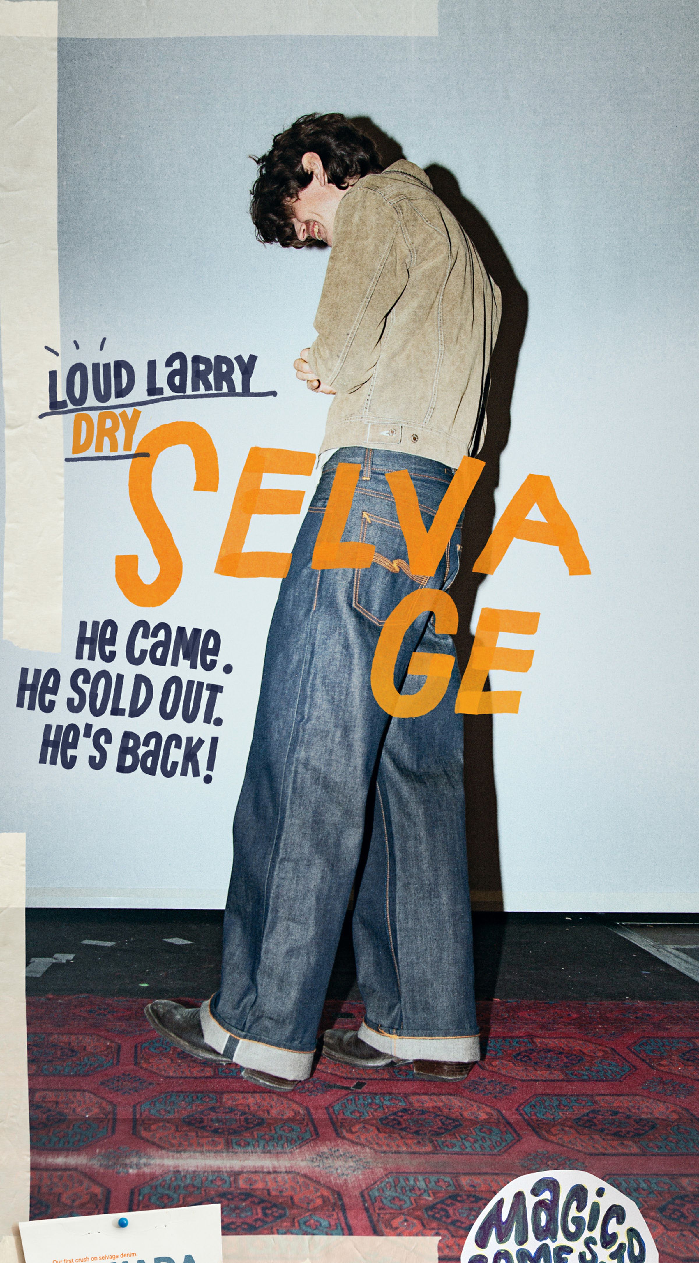 Person wearing a jacket and wide jeans stands against a wall with bold text, including "LOUD LARRY" and "DRY SELVAGE."