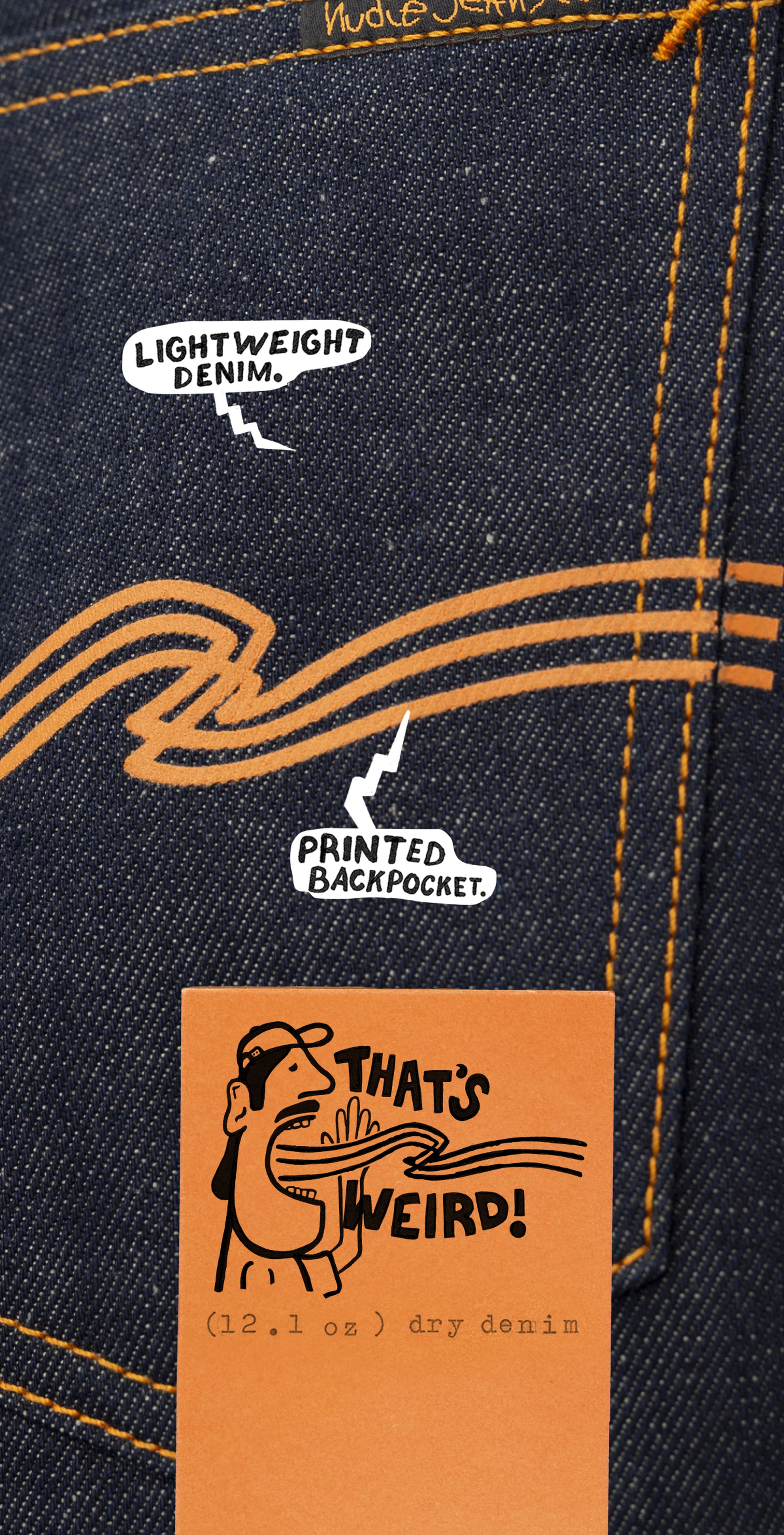 Close-up of Nudie Jeans raw selvedge denim back pocket with orange logo print and "That's Weird!" tag, 12.1 oz.