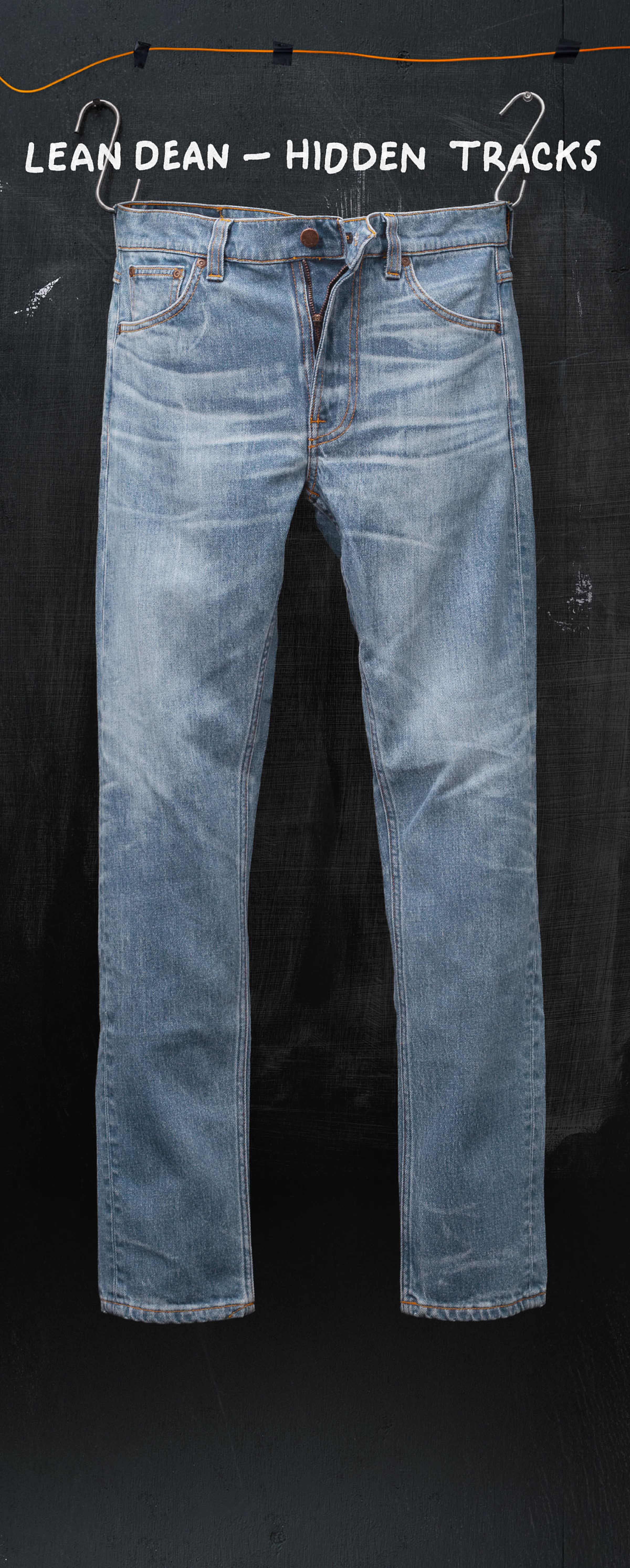Faded blue jeans hanging on a black background with "Lean Dean - Hidden Tracks" text above.