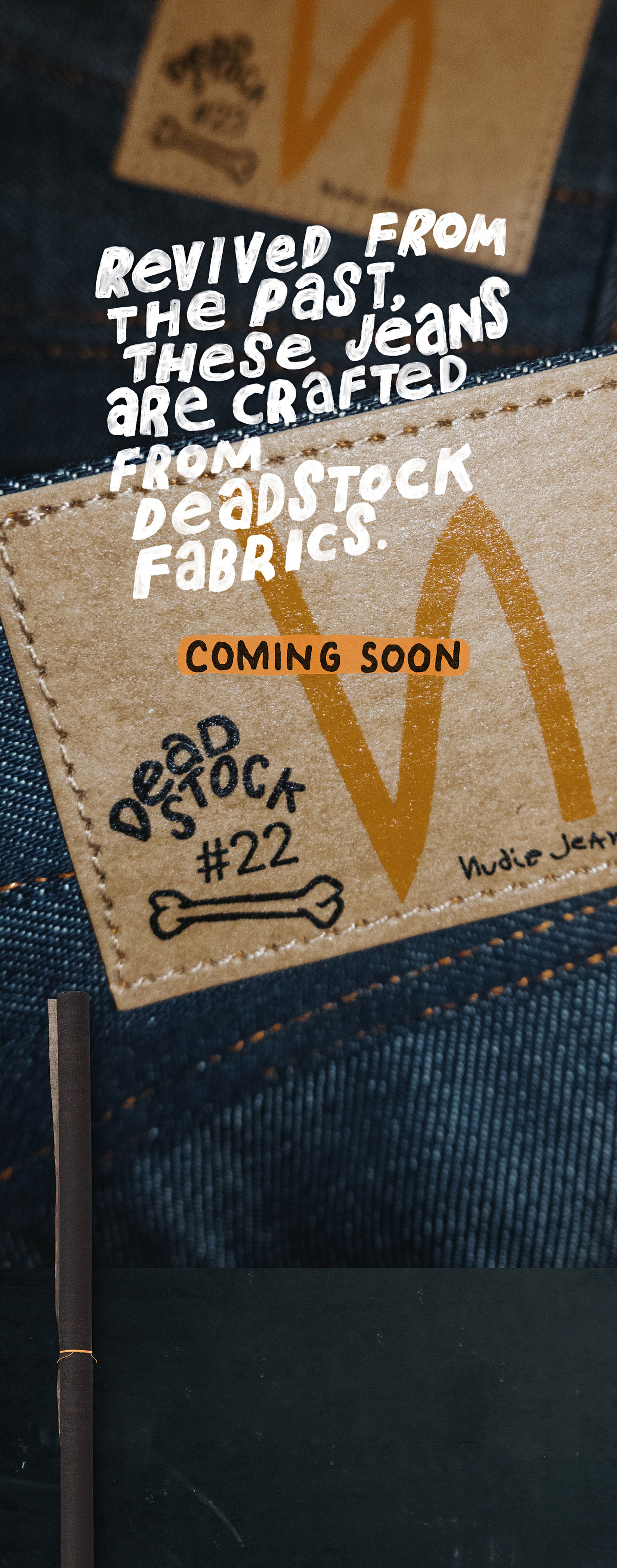 Jeans label displaying text about "deadstock #22" with a brown tag and blue denim fabric. Text reads: "Revived from the past... Coming Soon."