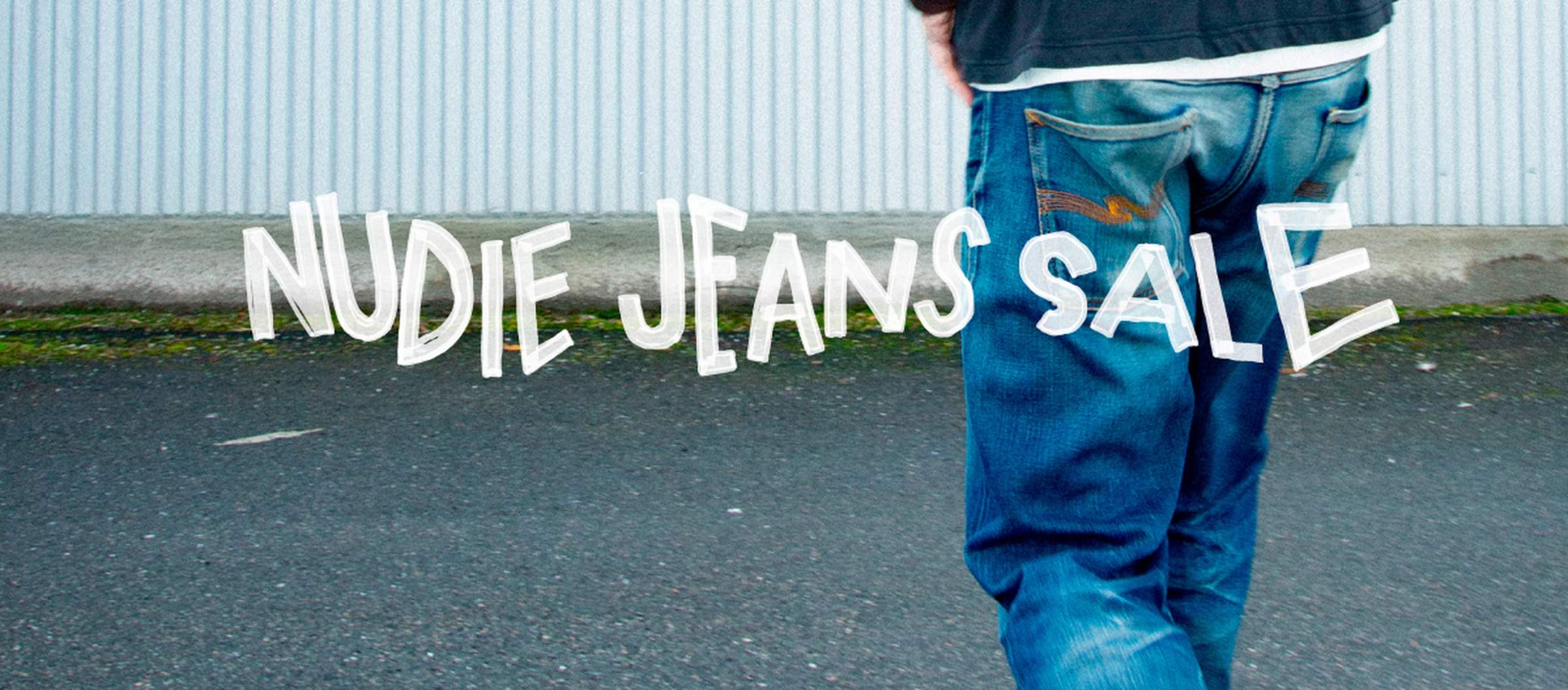 Person in denim walking, text overlay saying "Nudie Jeans Sale"
