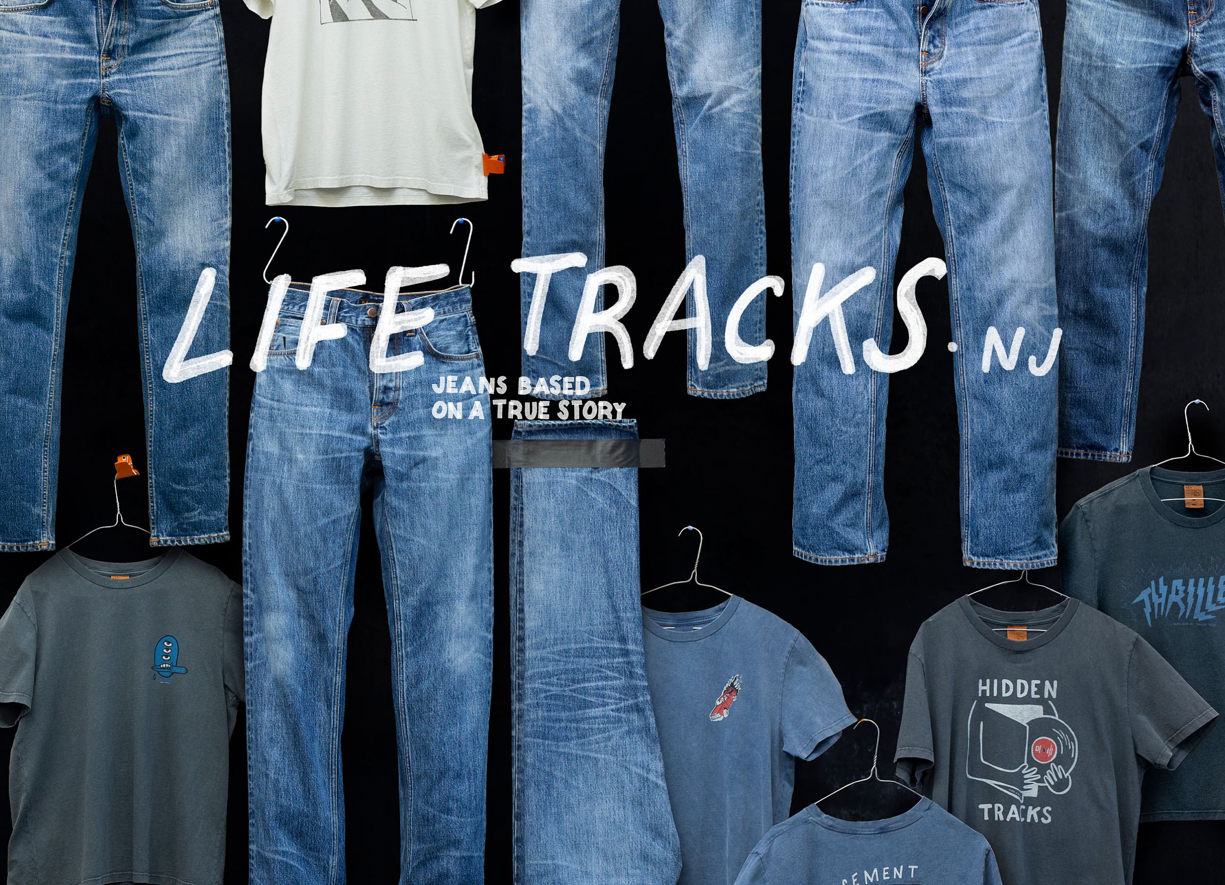 Denim jeans and t-shirts displayed against a black background with "LIFE TRACKS.NJ" written across in bold white letters.