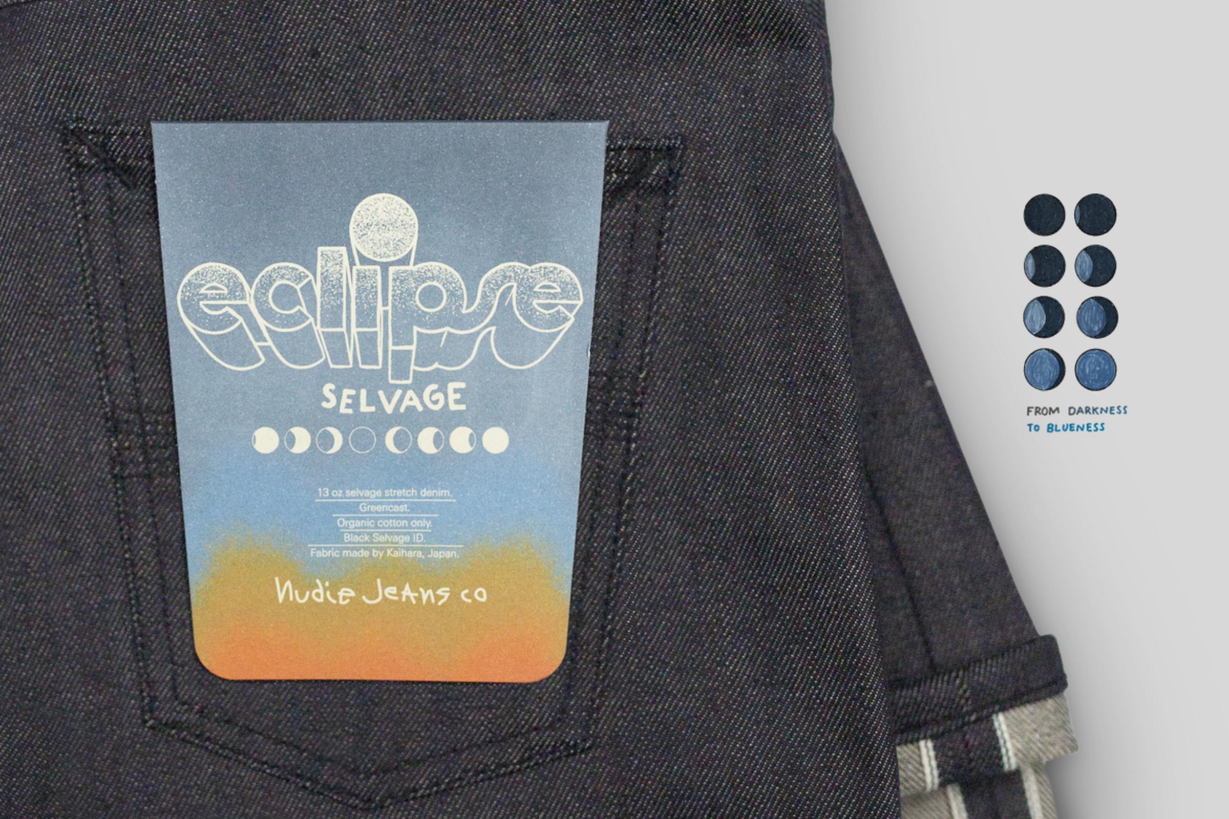 Close-up of dark jeans with a colorful label reading "eclipse selvage" and moon phases. A color gradient from dark blue to light blue is shown nearby.