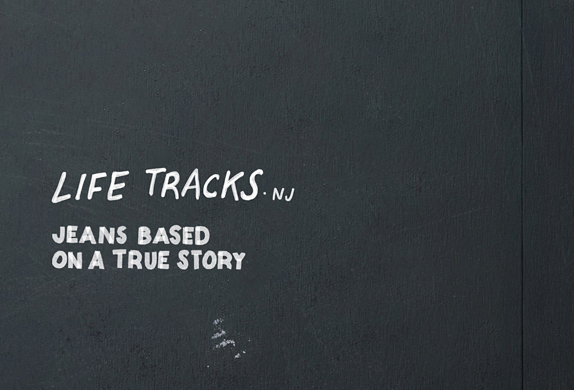 Text on a dark background reads "LIFE TRACKS.NJ JEANS BASED ON A TRUE STORY" in white, handwritten-style font.