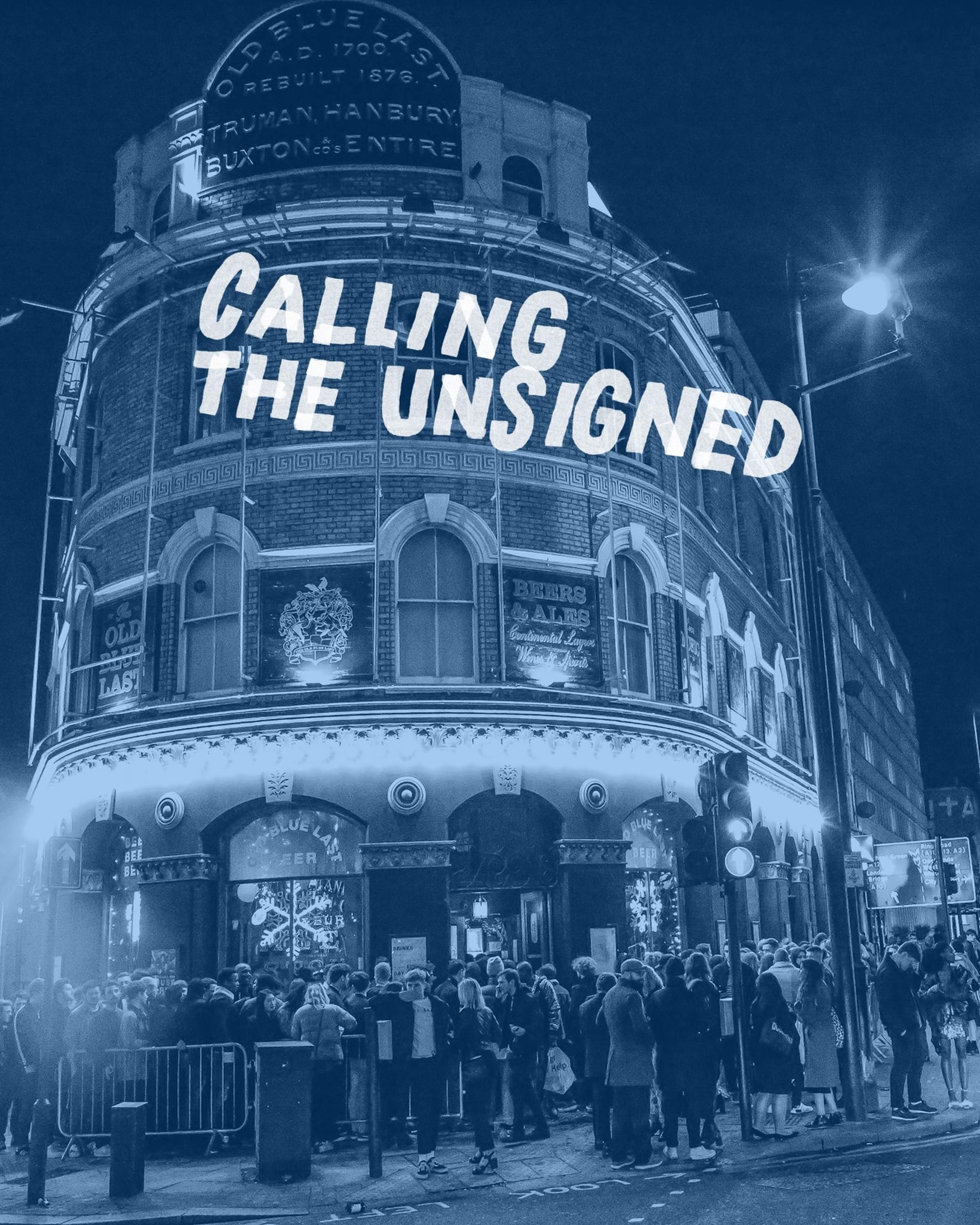 A crowd gathers outside a historic building with a sign reading "Calling the Unsigned" at night.