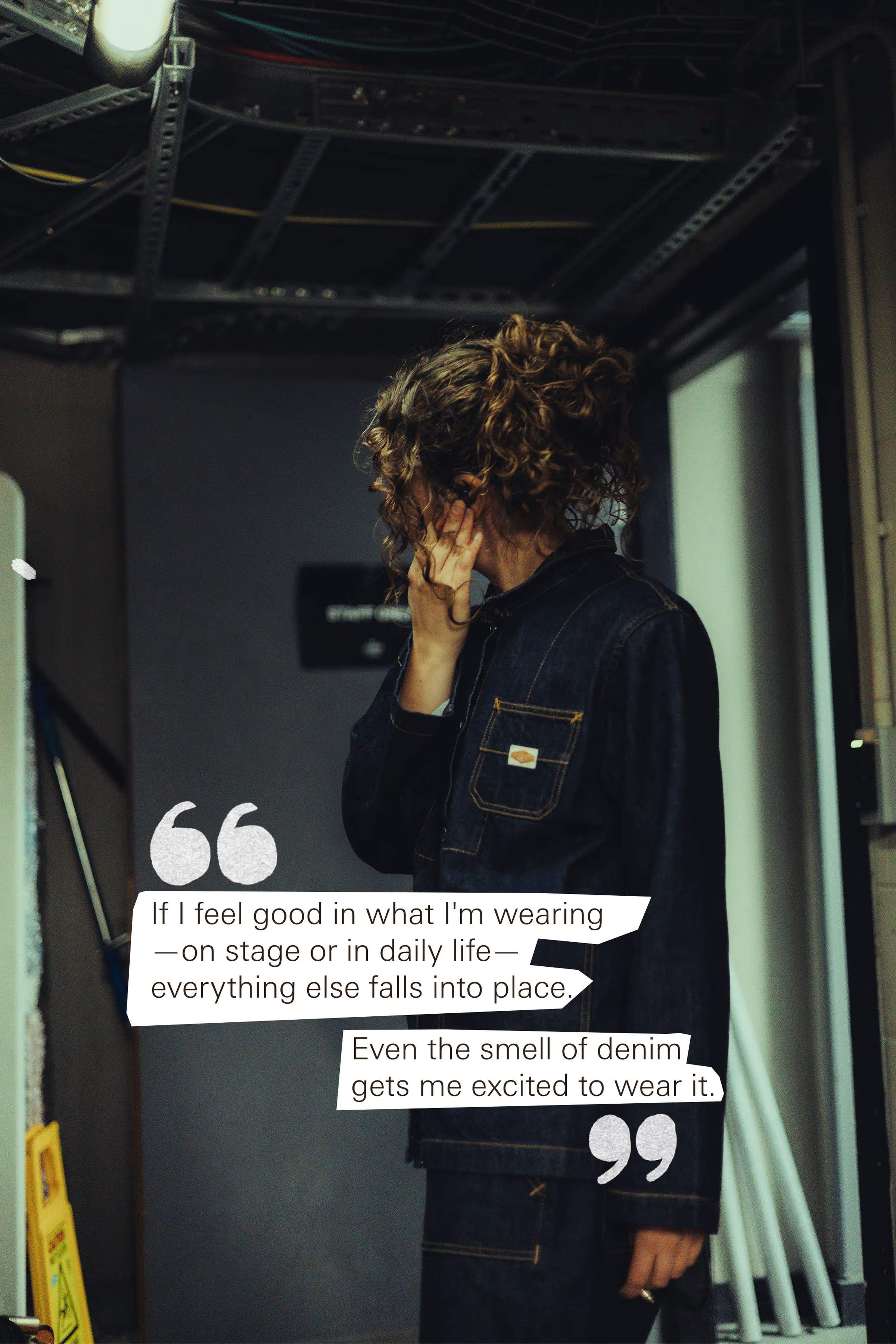 Polly Molly in a denim outfit stands in a dimly lit room, covering their face. Quotes about feeling good in denim are overlaid.