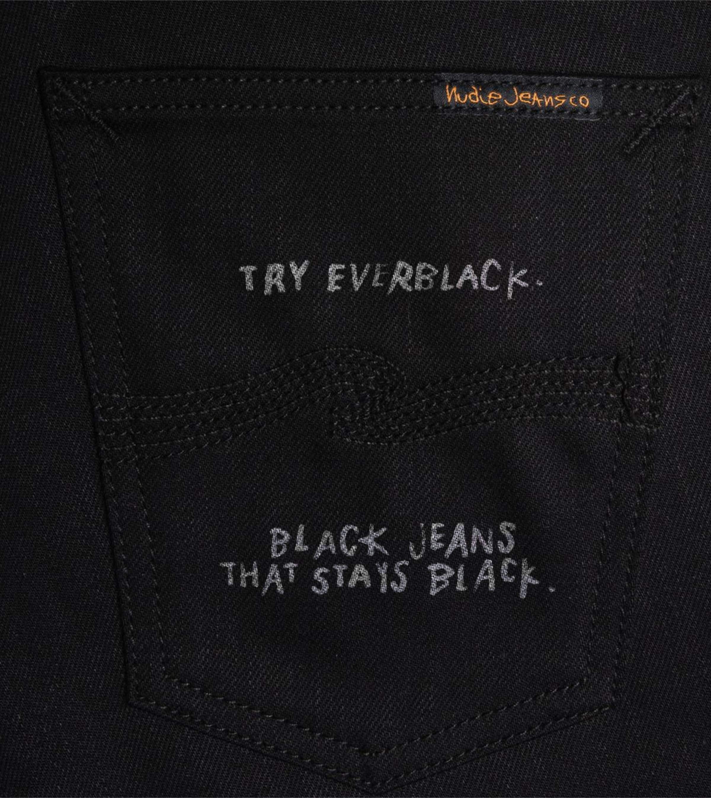 Close-up of Nudie Jeans Everblack back pocket with handwritten text "Try Everblack. Black jeans that stays black."