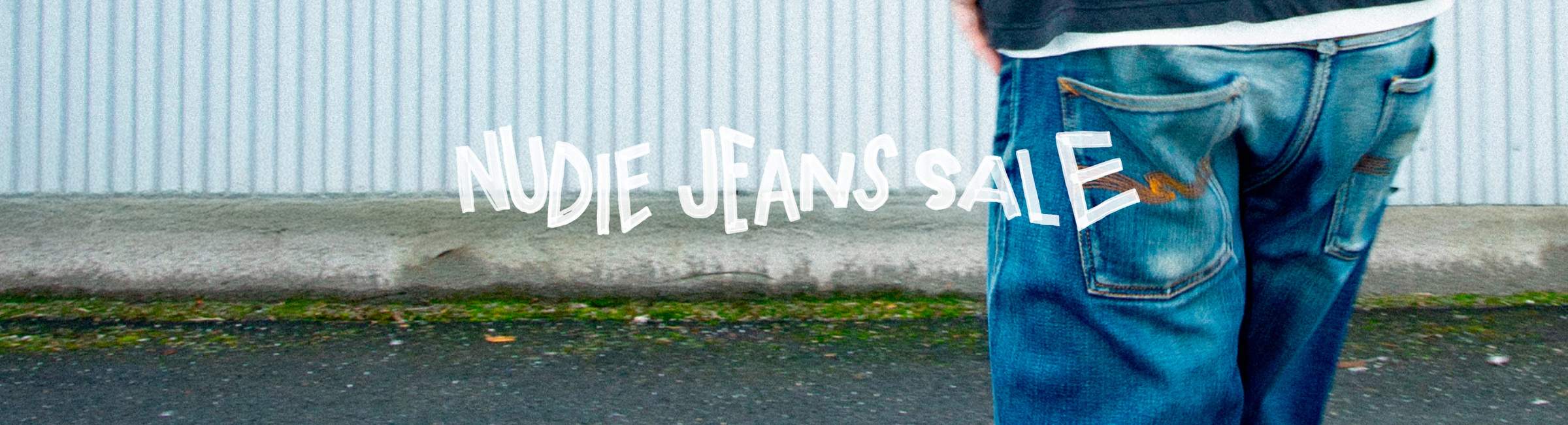 Person in denim walking, text overlay saying "Nudie Jeans Sale"