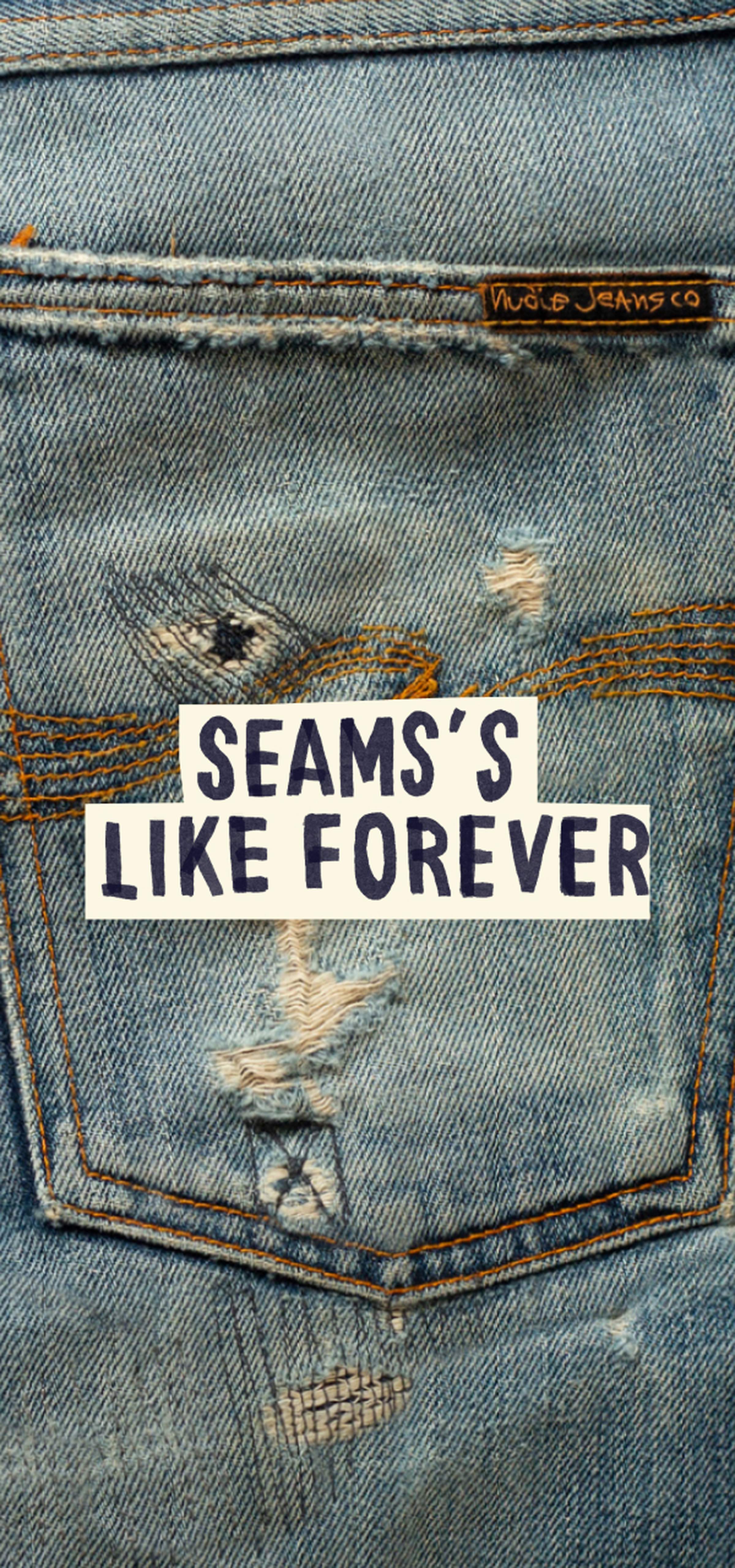 Close-up of distressed denim jeans with visible stitching and a label. Text overlay reads "Seams's Like Forever."