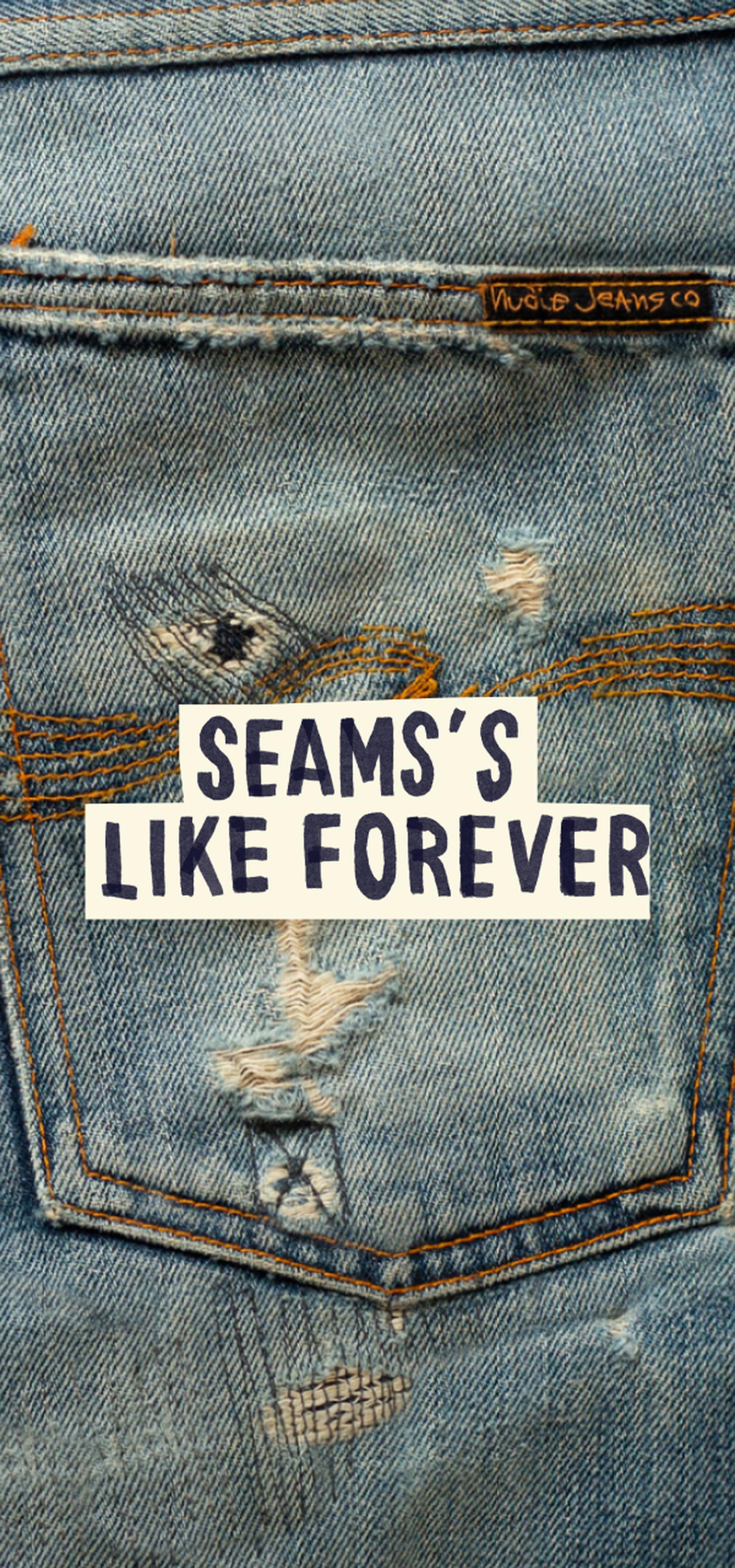 Close-up of distressed denim jeans with visible stitching and a label. Text overlay reads "Seams's Like Forever."