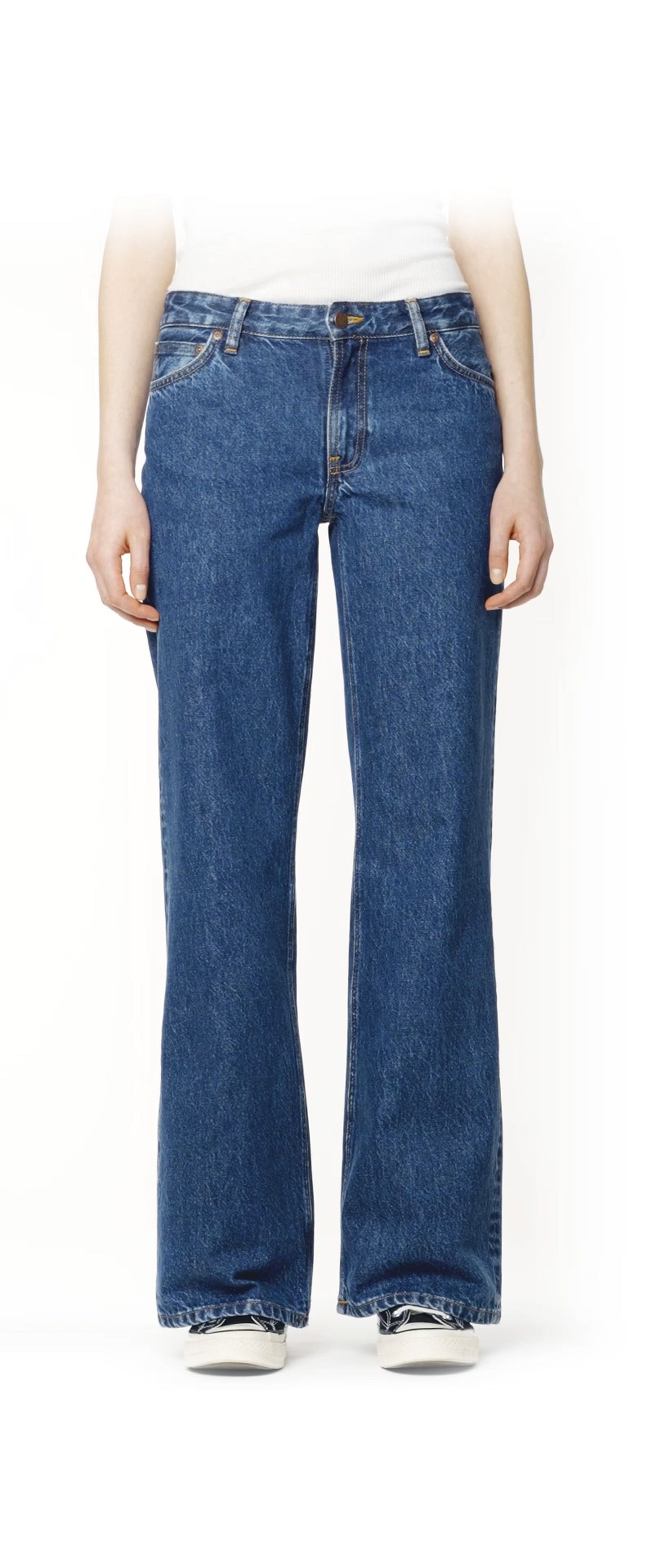 Person wearing Wide Heidi blue wide-leg jeans and a white top, standing against a plain background.