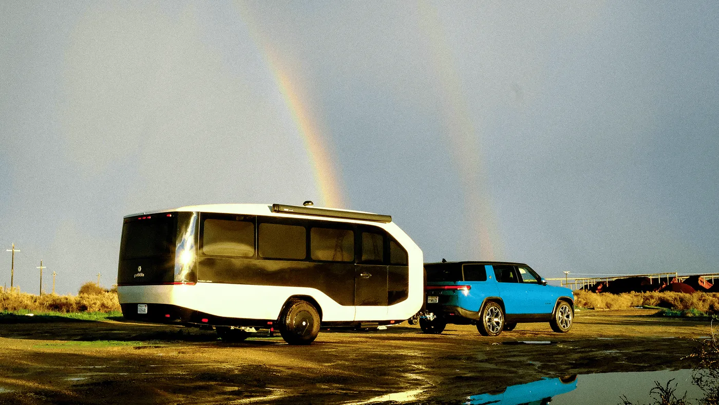Pebble and Rivian R1S with Double Rainbow