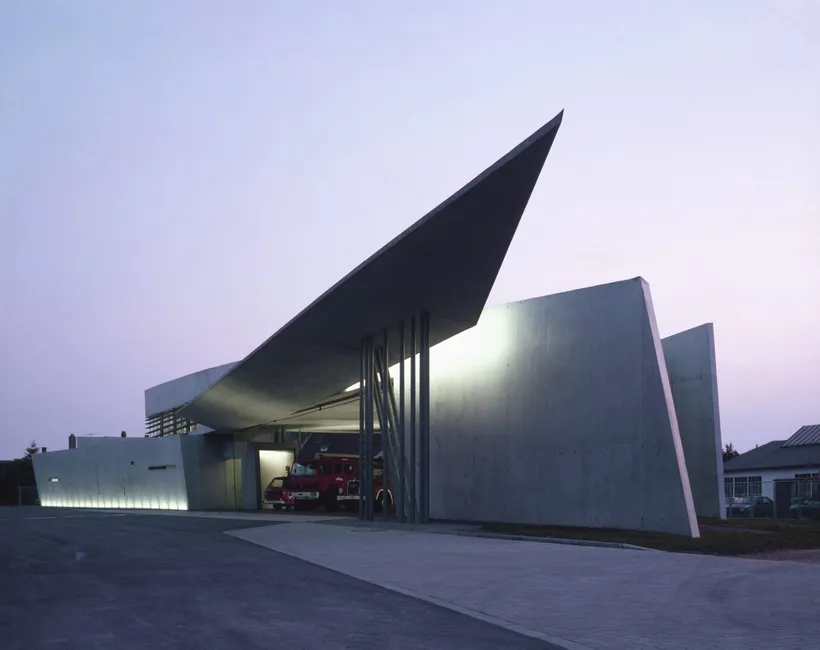 Zaha Hadid Architects, Vitra Fire Station, View towards fire engine space at dusk, Weil am Rhein, Germany, 1993 © Christian Richters