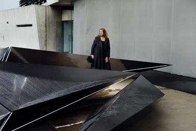 Zaha Hadid with her sculpture 'Prima', an installation to mark the 20th anniversary of the Vitra Fire Station, Weil am Rhein, Germany, 2013 © Felix Kunze, courtesy of Getty Images