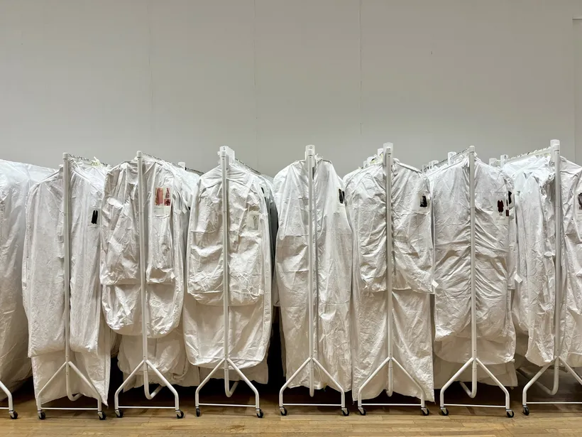 Clothing rails with garments from Zaha Hadid’s personal collection, 2025 © Zaha Hadid Foundation