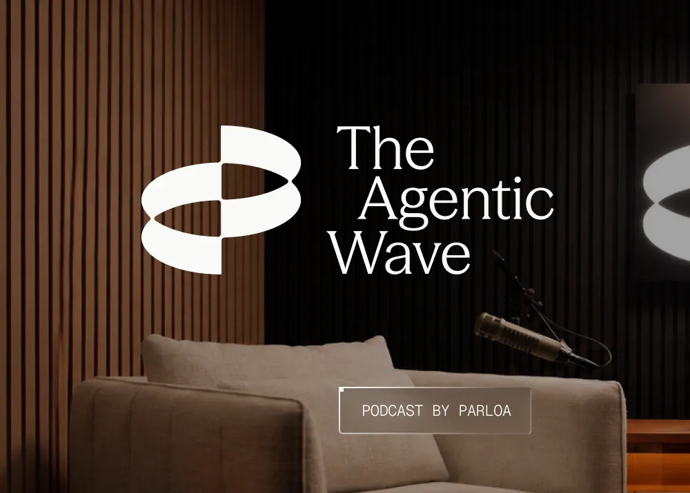 A cozy podcast studio setup with a microphone, cushioned chair, and the text "The Agentic Wave" and "Podcast by Parloa" against a wooden backdrop.