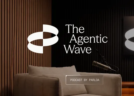 A cozy podcast studio setup with a microphone, cushioned chair, and the text "The Agentic Wave" and "Podcast by Parloa" against a wooden backdrop.
