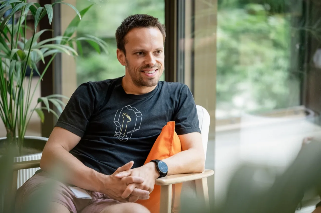Man sitting relaxed in the office lounge