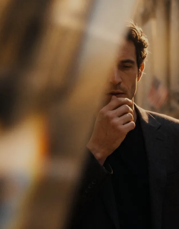 Man in a suit, lost in thought