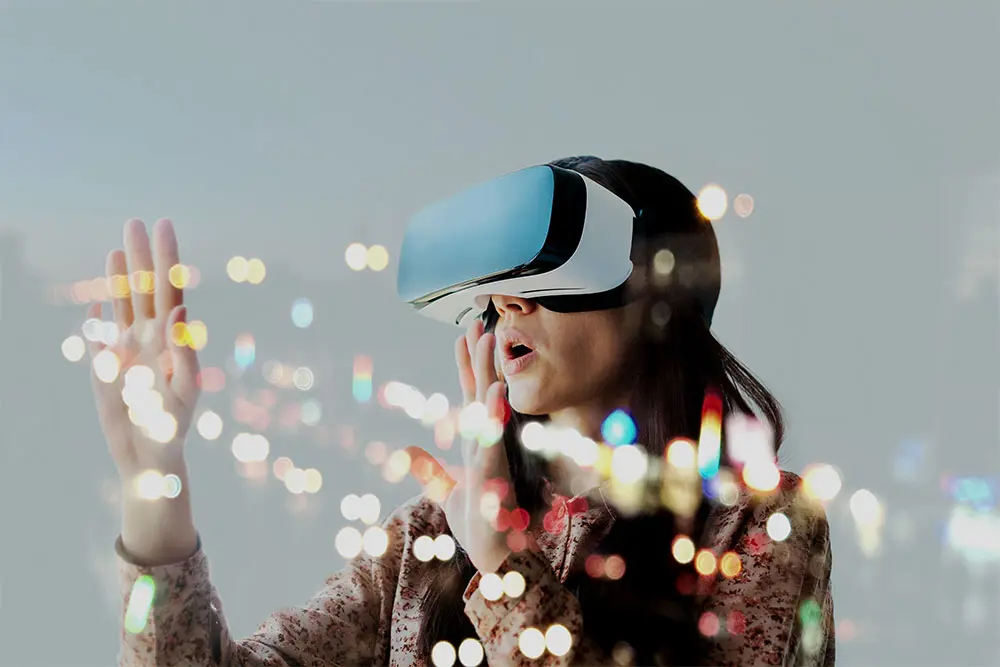 Person wearing a VR headset, surrounded by abstract lights, experiencing a virtual environment.