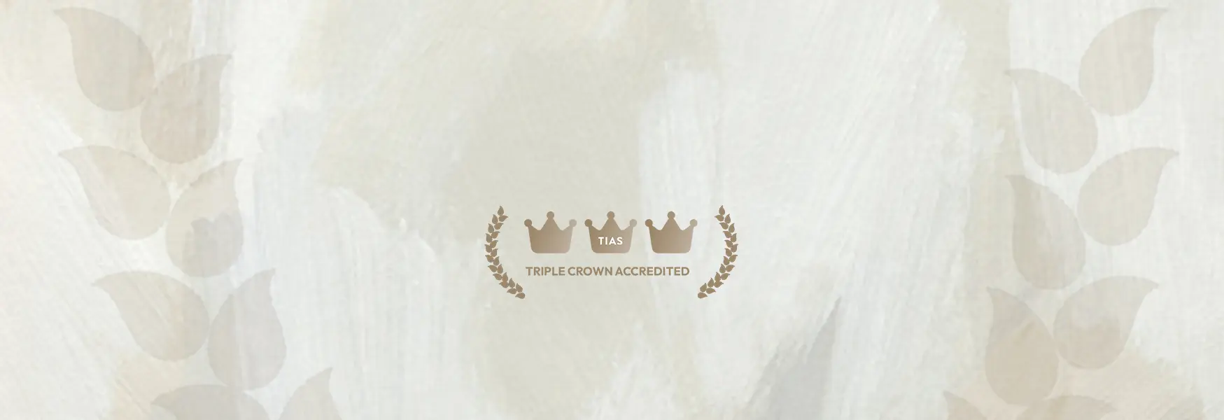 TIAS Triple Crown Accredited logo with crowns and laurel wreaths on a textured beige background.