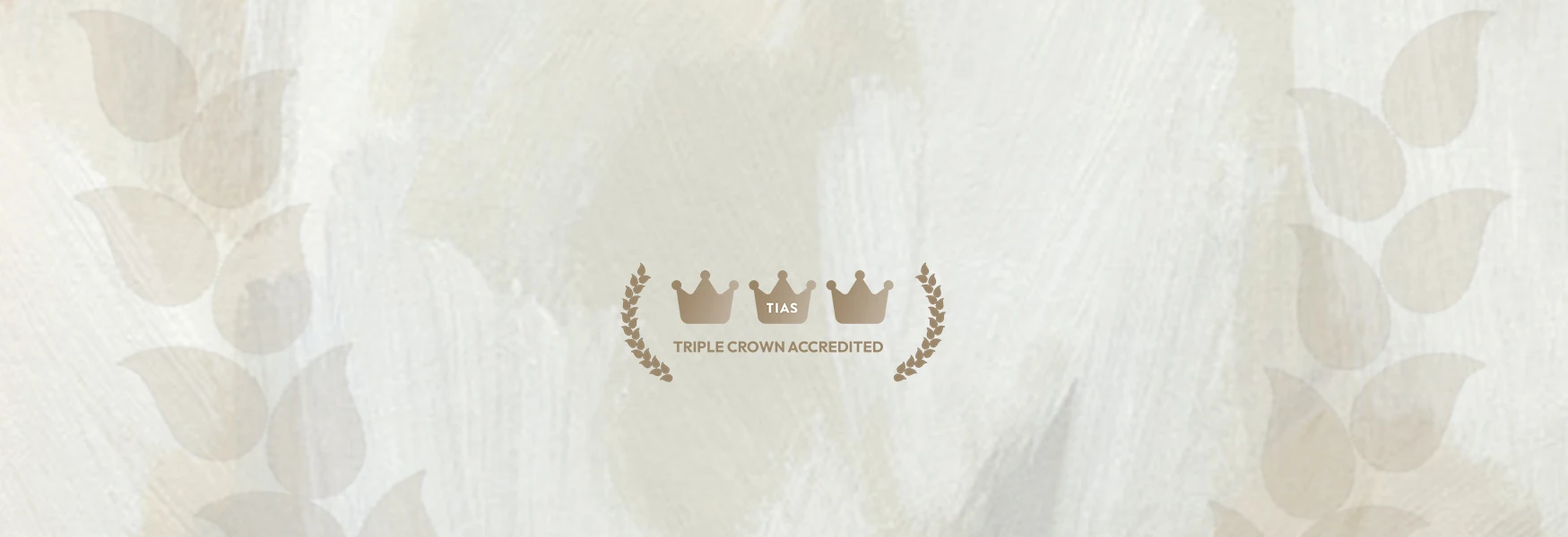 TIAS Triple Crown Accredited logo with crowns and laurel wreaths on a textured beige background.