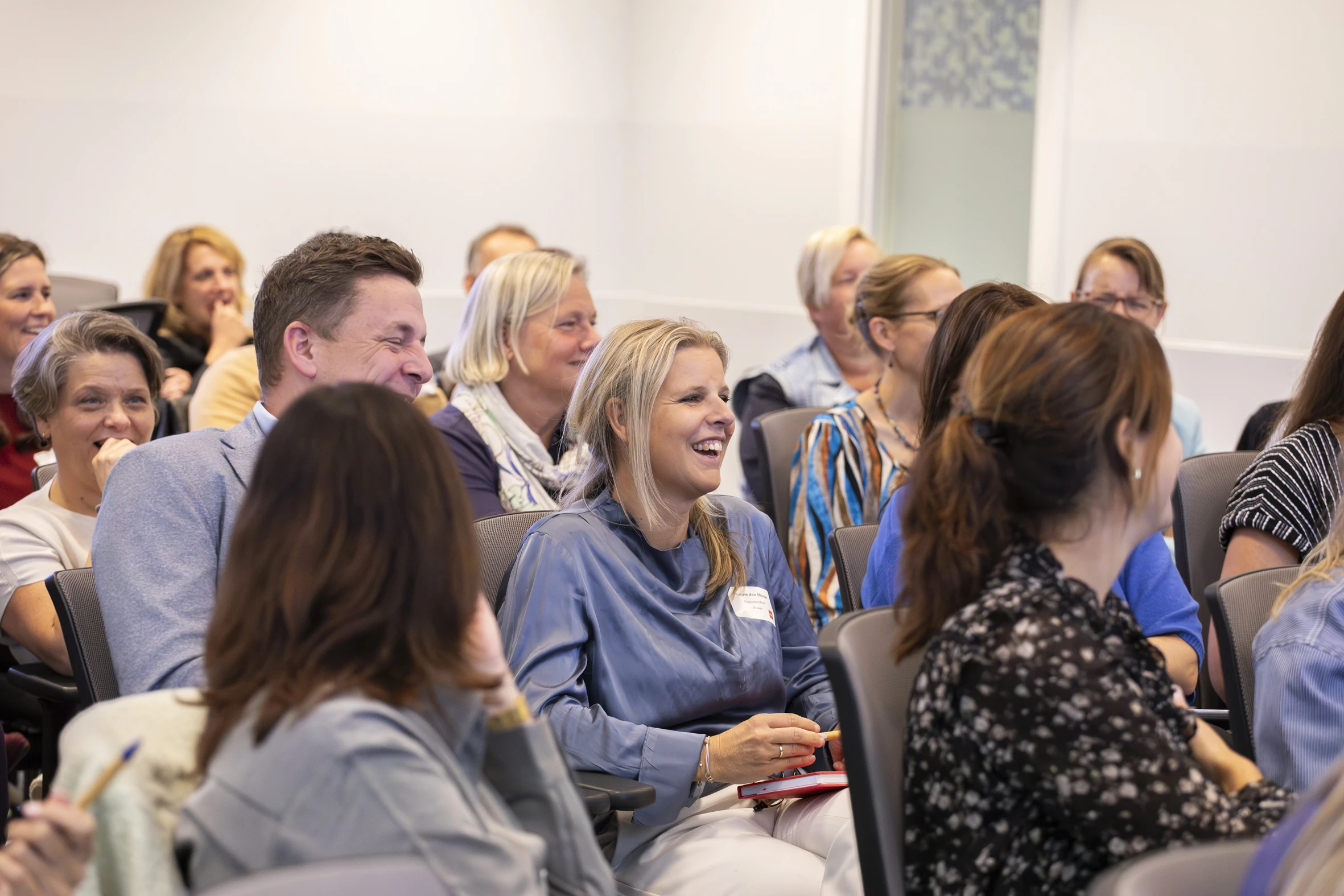 Laughing woman, classroom, presentation