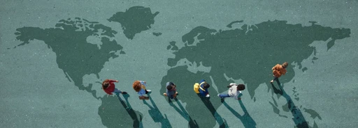 People walking on a world map painted on the ground, casting long shadows across different continents.