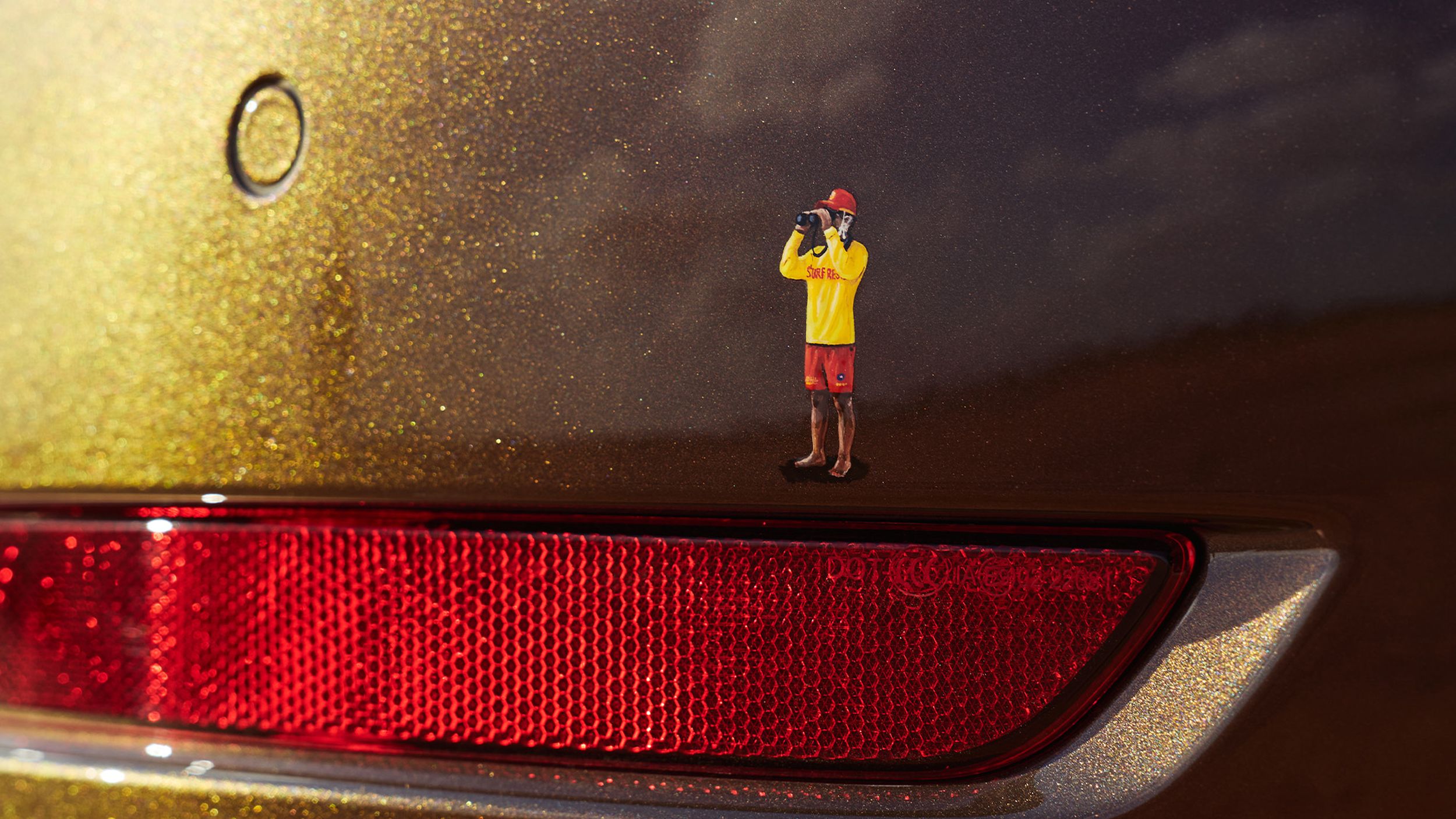 Decal of a man in surf rescue apparel.