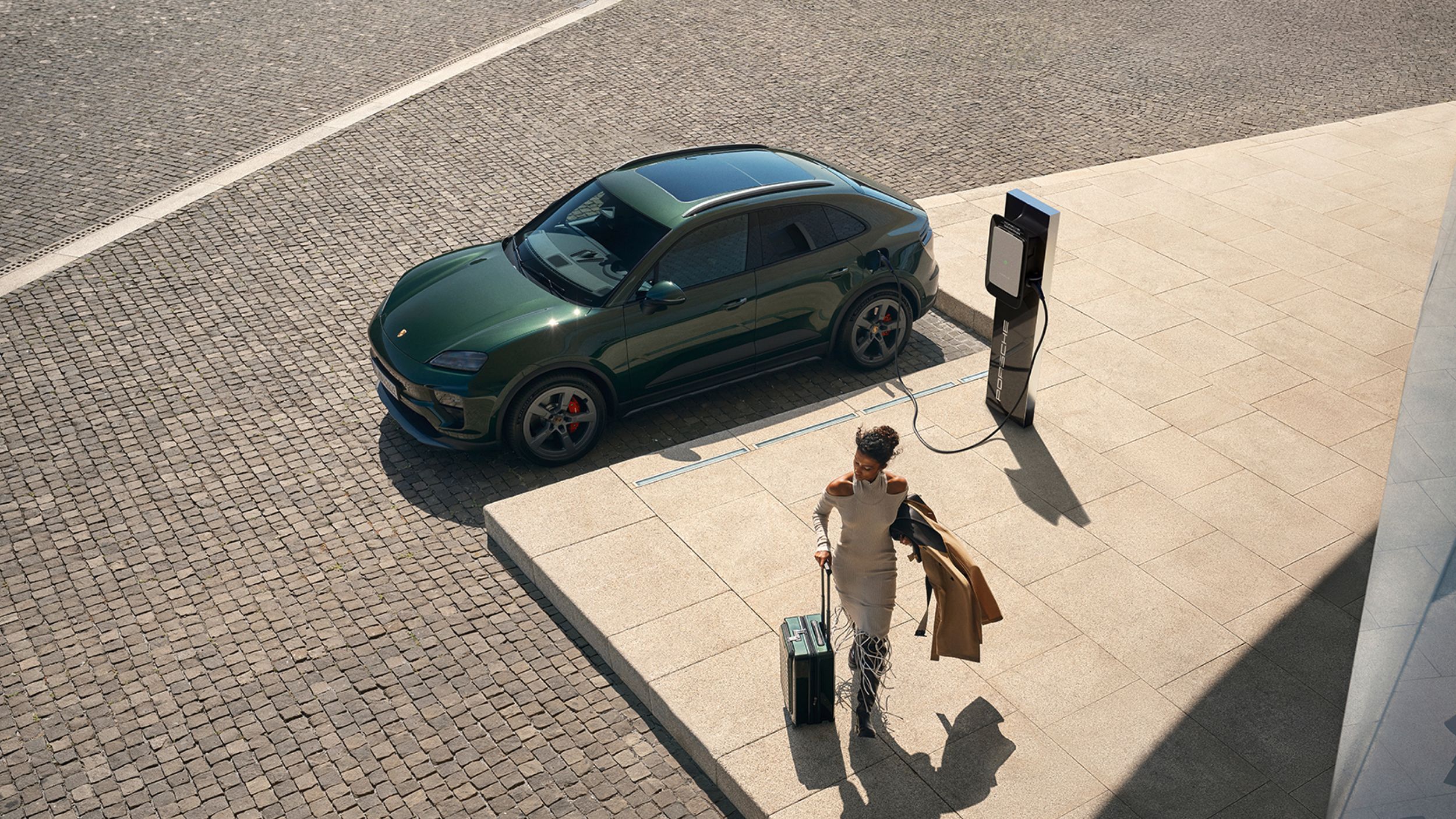 App view showing Porsche Charging Lounge with charging station and ‘Access now’ button in the foreground.