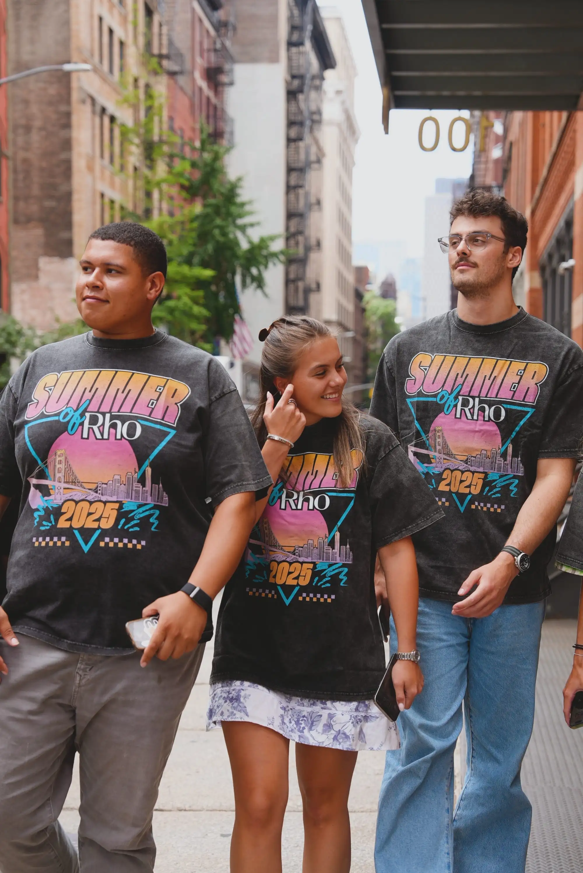 Teammates in Summer by Rho tees walking through SoHo