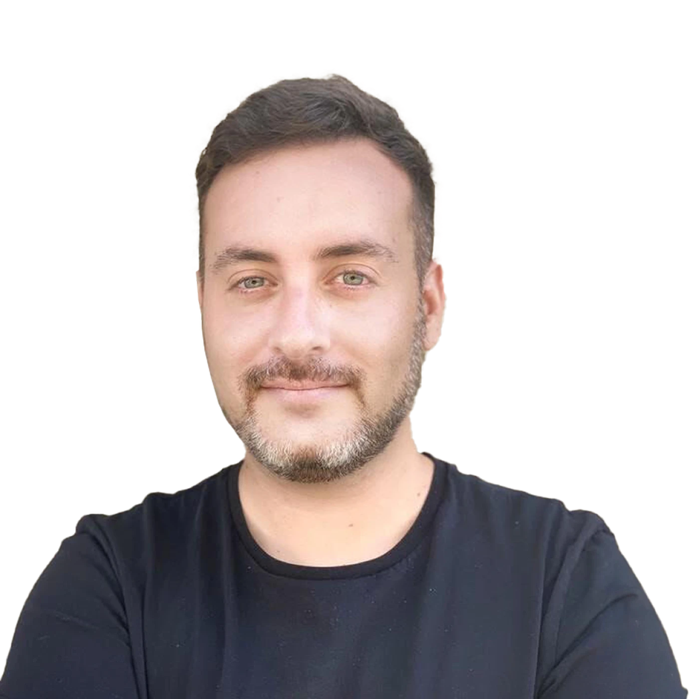 Man with short hair and a beard, wearing a black shirt, smiling with arms crossed against a plain white background.